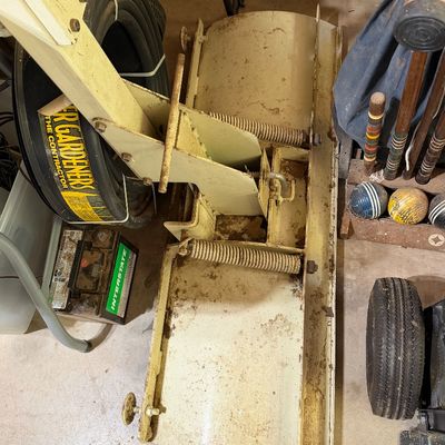 Sale Photo Thumbnail #275: Heavy-duty cream-colored snow plow attachment for a lawn tractor or ATV, showing light surface dirt and wear.