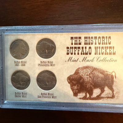 Sale Photo Thumbnail #246: "The Historic Buffalo Nickel Mint Mark Collection" set, featuring four Buffalo nickels from various mints housed in a protective display case.