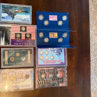 Sale Photo Thumbnail #244: Assorted US coin collection sets, including World War II silver dimes, obsolete coinage, and early 20th-century commemorative sets.