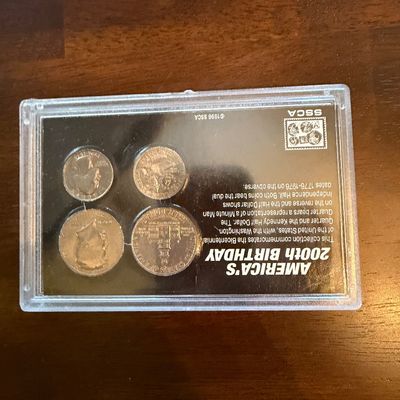 Sale Photo Thumbnail #234: "America's 200th Birthday" commemorative coin set by SSCA, featuring 1776-1976 bicentennial Washington quarters and Kennedy half dollars in a protective plastic display case.