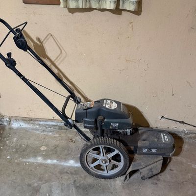 Sale Photo Thumbnail #271: Craftsman 5.5 HP 22-inch walk-behind wheeled string trimmer mower, showing light wear from use.