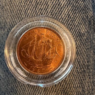 Sale Photo Thumbnail #257: British 1967 half penny coin depicting the Golden Hind sailing ship, housed in a clear protective plastic capsule.