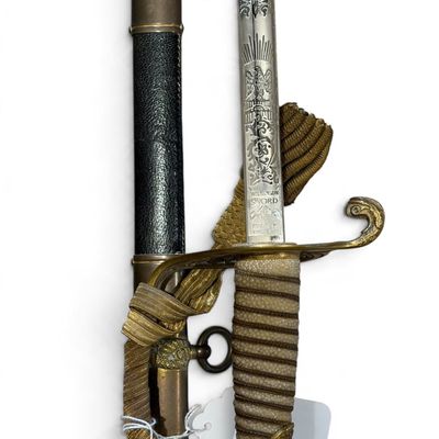 Vintage Wilkinson Sword ceremonial sword featuring an etched blade, brass guard with ornate hilt, wire-wrapped shagreen grip, and gold...