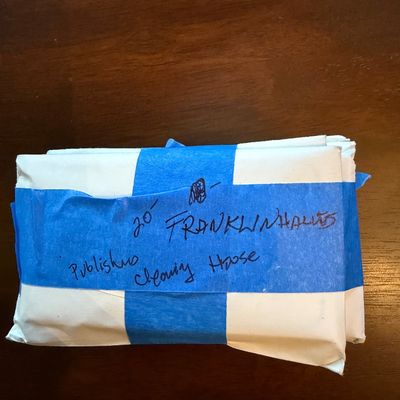 Sale Photo Thumbnail #235: A wrapped bundle of 20 Franklin Half Dollars, labeled as being from the Publishers Clearing House.