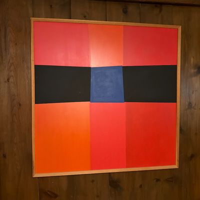 Large mid-century modern abstract color field painting featuring geometric blocks of red, orange, black, and blue, housed in a simple...