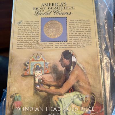 Sale Photo Thumbnail #220: Collectible display card for a $5 Indian Head Gold Piece (1908-1929), featuring historical information and a Native American illustration, preserved in a plastic sleeve.