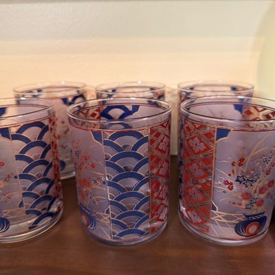 Set of six vintage lowball glasses featuring a frosted finish with Japanese-inspired blue, red, and gold geometric and floral patterns.