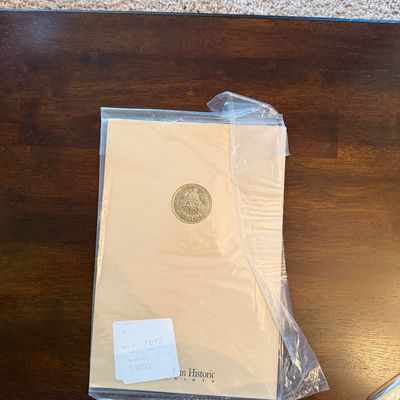 Sale Photo Thumbnail #264: American Historic Society commemorative coin set sealed in a protective plastic sleeve, complete with an inventory label.