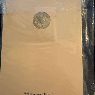 Sale Photo Thumbnail #262: The American Historic Society coin set folder, sealed in original plastic sleeve.