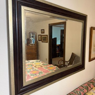 Sale Photo Thumbnail #197: Large rectangular wall mirror featuring a wide, multi-tiered frame with dark wood and textured silver-gilt finishes.