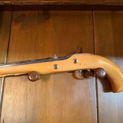 Connecticut Valley Arms Kentucky .50 caliber black powder percussion pistol, featuring a light wood stock and brass accents.