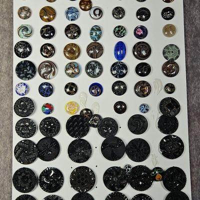 Sale Photo Thumbnail #219: A Collection of Antique and Vintage Black Glass and Slag Glass Buttons