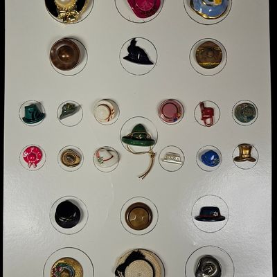 A Collection of Twenty-Six Vintage Novelty Hat Buttons and Pins