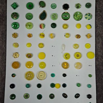 Sale Photo Thumbnail #260: A Collection of Approximately 78 Vintage Glass Buttons in Green, Yellow, and Amber Tones