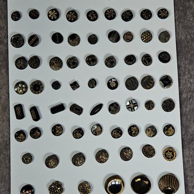 Sale Photo Thumbnail #168: A Collection of Approximately 80 Vintage and Antique Black Glass Buttons Featuring Gold Luster and Specialty Designs