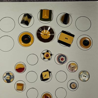 An Assortment of Art Deco and Mid Century Modern Laminated Bakelite and Early Plastic Buttons