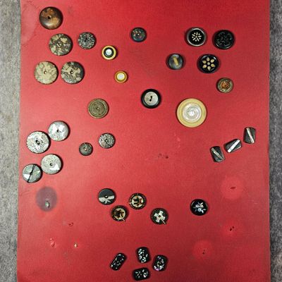 Sale Photo Thumbnail #279: A Collection of Antique and Vintage Buttons Including Black Glass, Lacquer, and Mother-of-Pearl Examples