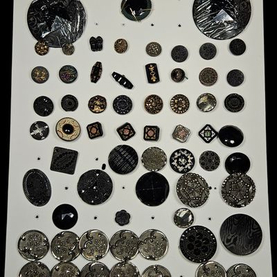 Sale Photo Thumbnail #184: A Collection of Antique Black Glass and Silver Toned Repousse Metal Buttons