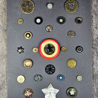A Collection of Twenty-Seven Celestial Themed Buttons Featuring Glass, Metal, and Mother-of-Pearl