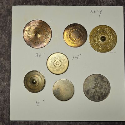 A Collection of Seven Antique Stamped Metal Buttons