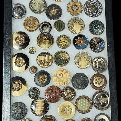 Sale Photo Thumbnail #161: A Collection of Antique and Vintage Decorative Buttons in a Display Case