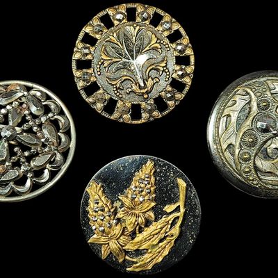 A Group of Four Large Victorian and Art Nouveau Steel Cut and Mixed Metal Buttons