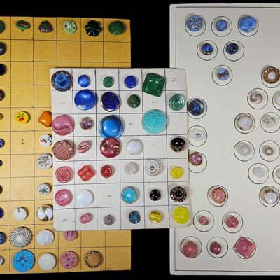 Sale Photo Thumbnail #110: A Large Collection of Vintage Glass and Plastic Buttons Mounted on Display Cards