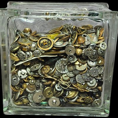 Sale Photo Thumbnail #340: An Assortment of Vintage and Antique Style Metal Buttons in a Glass Block Container