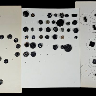 Sale Photo Thumbnail #300: An Assortment of Antique and Vintage Black Glass Buttons Including Victorian Luster and Figural Examples