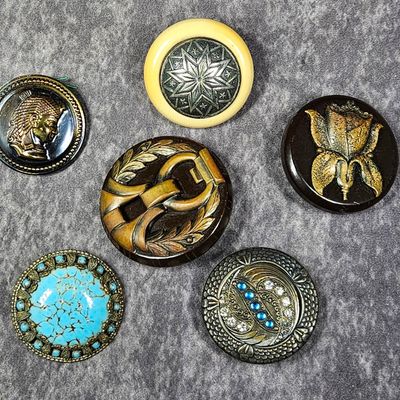 An Assortment of Six Vintage and Antique Ornamental Buttons Including Egyptian Revival and Art Deco Styles