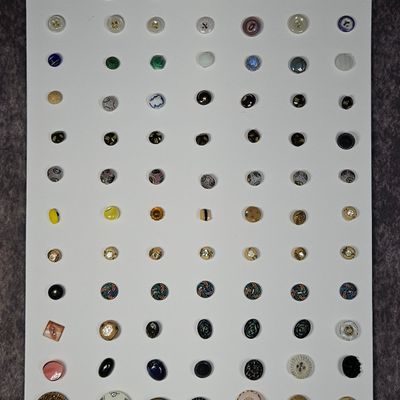 Sale Photo Thumbnail #208: An Assortment of Vintage and Antique Collectible Buttons
