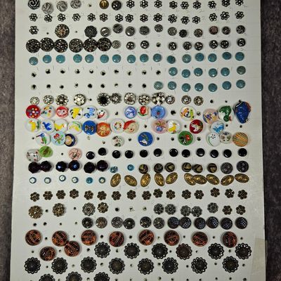 Sale Photo Thumbnail #241: A Collection of Approximately 160 Antique and Vintage Sewing Buttons Including Pictorial Glass and Metal Examples