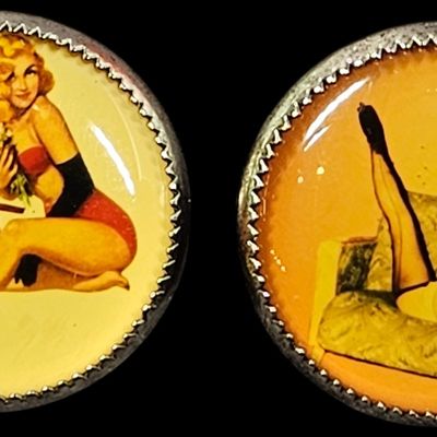 A Pair of Silver Tone Shank Back Buttons Featuring Pin Up Girl Illustrations