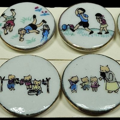 A Group of Eight Vintage Hand Painted Porcelain Nursery Rhyme and Kitten Narrative Buttons