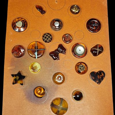 Sale Photo Thumbnail #123: A Collection of Assorted Vintage Tortoise and Amber Type Plastic Buttons