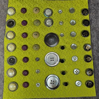 Sale Photo Thumbnail #142: A Collection of Vintage and Antique Sewing Buttons in Metal, Shell, and Composite Materials