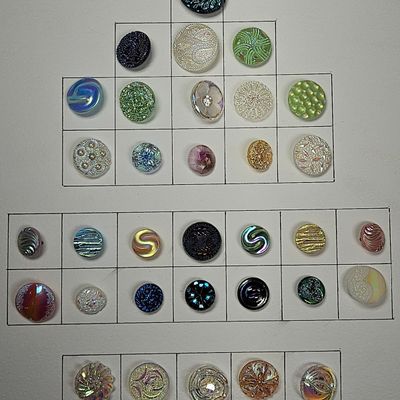A Collection of Decorative Glass Buttons with Luster and Iridescent Finishes