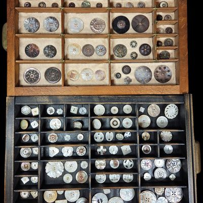 Sale Photo Thumbnail #150: A Large Collection of Mother of Pearl and Abalone Shell Buttons in Divided Wooden Trays