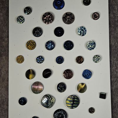 Sale Photo Thumbnail #196: An Assortment of 42 Vintage Black Glass Luster Buttons