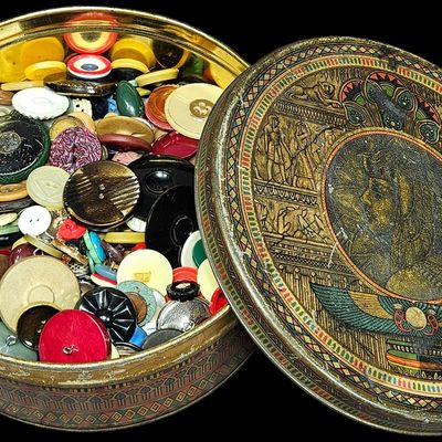 Sale Photo Thumbnail #353: A Large Collection of Vintage and Antique Buttons in an Egyptian Revival Decorative Tin