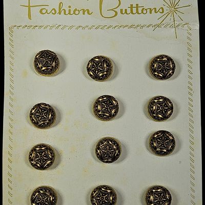 Sale Photo Thumbnail #276: A Set of Twelve Vintage Gold Tone Filigree Star Fashion Buttons on Original Display Card