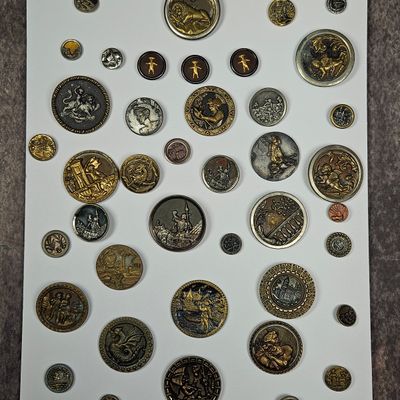 Sale Photo Thumbnail #247: A Collection of Antique and Vintage Relief Molded Metal Picture Buttons