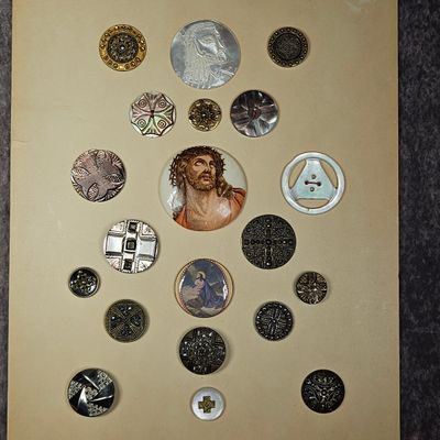 Sale Photo Thumbnail #244: A Collection of Antique and Vintage Buttons Including Religious Transfer Prints and Carved Mother of Pearl