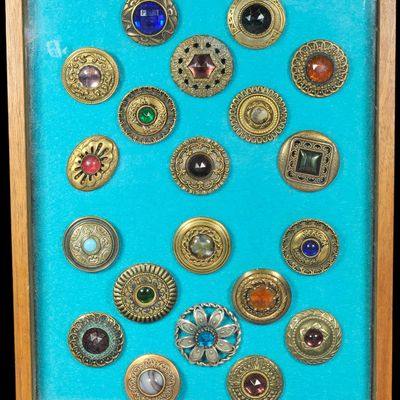 Sale Photo Thumbnail #284: A Collection of Twenty Vintage Decorative Metal and Glass Buttons in a Display Case