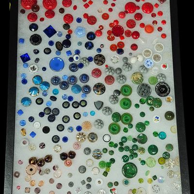 Sale Photo Thumbnail #158: A Collection of Approximately 300 Vintage and Antique Glass, Plastic, and Metal Buttons in a Display Case