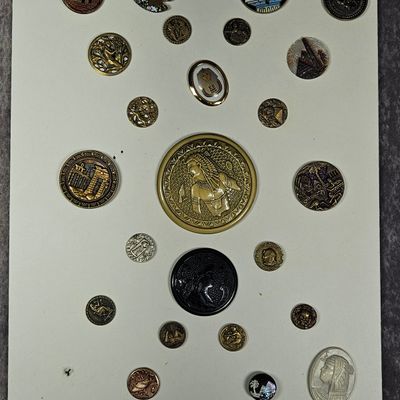 An Assortment of Twenty-Two Egyptian Revival and Classical Themed Buttons and Two Decorative Elements