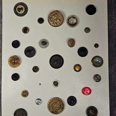 An Assortment of Antique and Vintage Novelty Garment Buttons Featuring Classical and Historical Profiles
