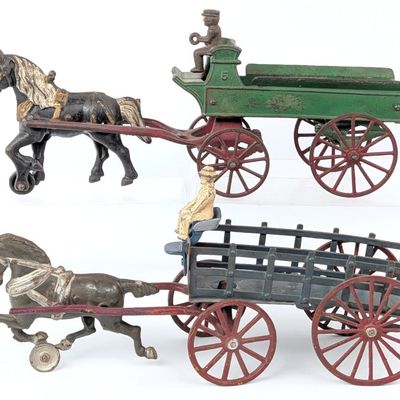 (2) Cast Iron Horse Drawn Wagons