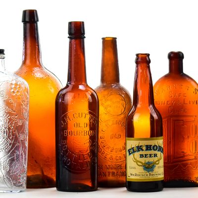 HARD LIQUOR GLASS BOTTLE ASSORTMENT: JESSE MOORE, GARRETT'S, WARNER'S