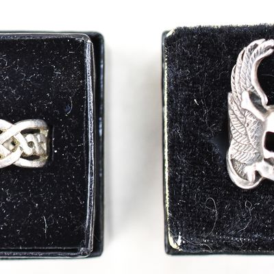 PAIR OF STERLING SILVER CARVED RINGS